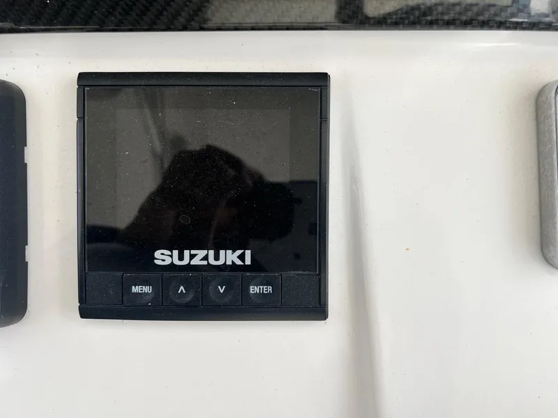 Slide: The Image of Suzuki display panel on 2019 Sea Cat 260 boat dashboard. - 17
