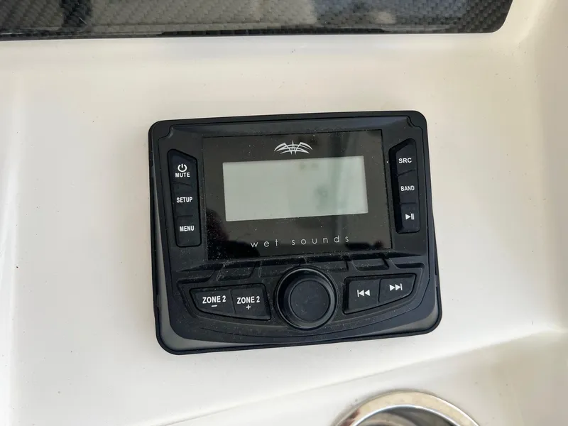 Slide: The Image of Wet Sounds audio control panel on 2019 Sea Cat 260 boat dashboard. - 18