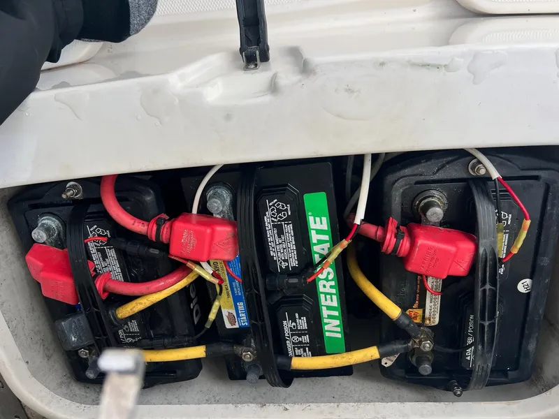 Slide: The Image of Battery compartment of a 2019 Sea Cat 260 boat with Interstate batteries. - 19