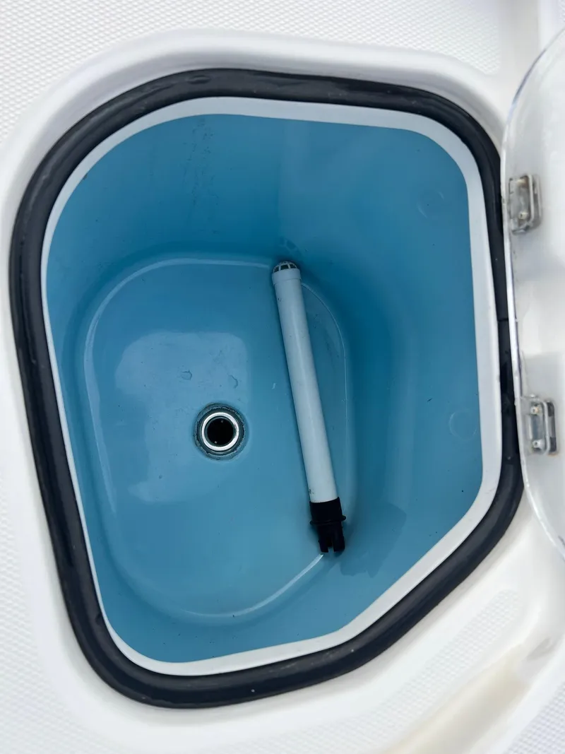 Slide: The Image of Livewell compartment of 2019 Sea Cat 260 boat, featuring a blue interior. - 20