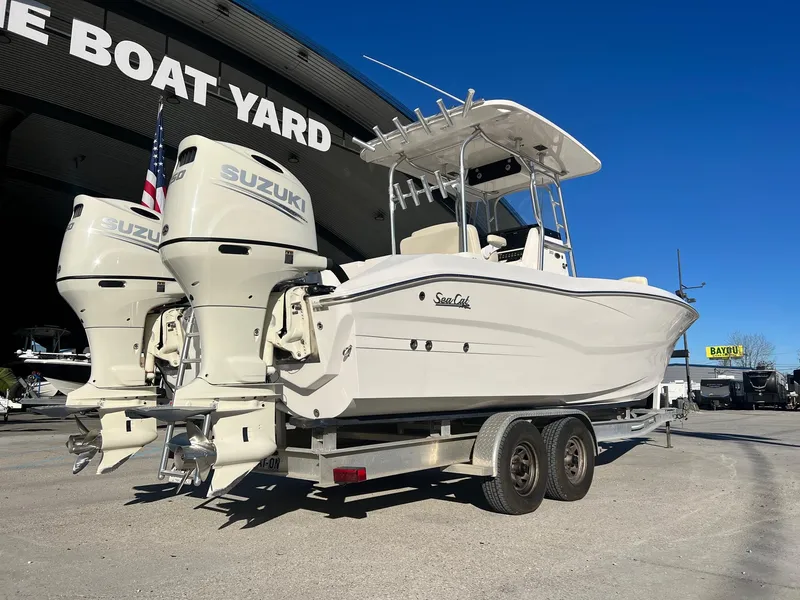 Slide: The Image of 2019 Sea Cat 260 boat with twin Suzuki engines on a trailer at a boat yard. - 3