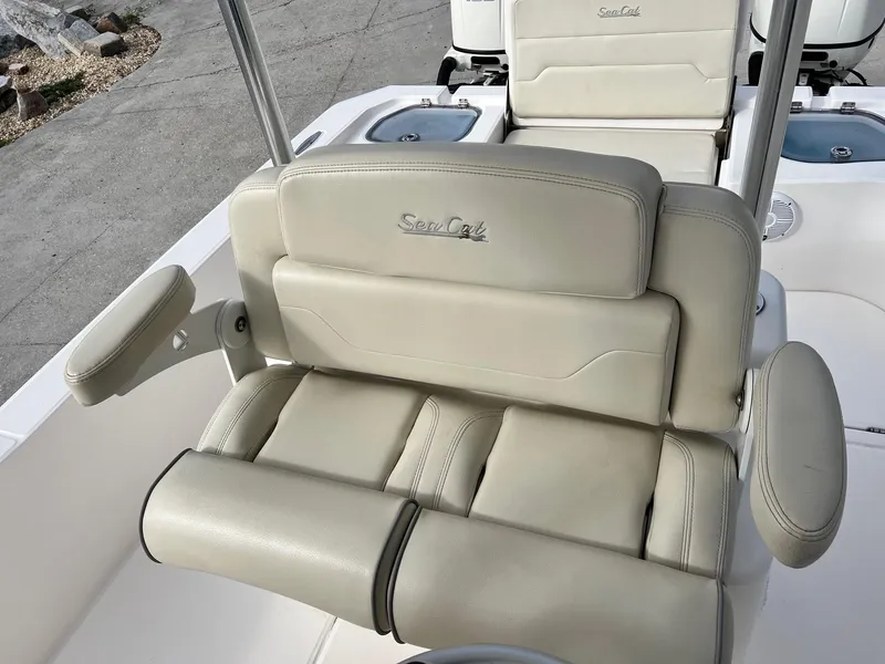 Slide: The Image of 2019 Sea Cat 260 boat seat with beige upholstery and armrest. - 8