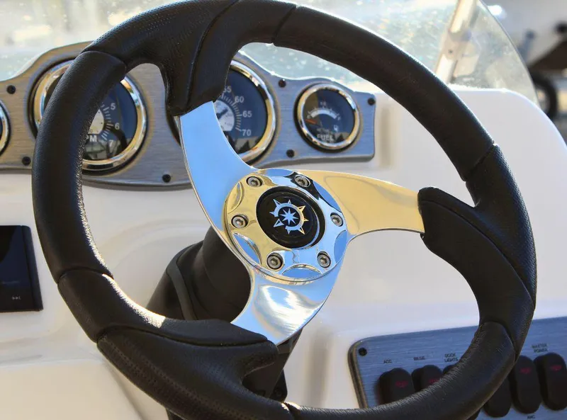 Slide: The Image of 2024 NauticStar 193 SC steering wheel and dashboard close-up. - 14