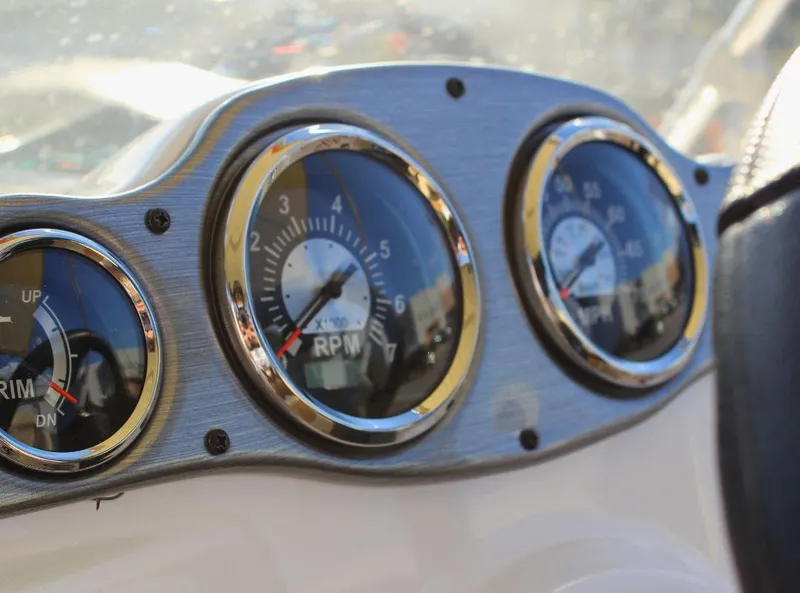 Slide: The Image of Dashboard gauges of 2024 NauticStar 193 SC boat, showing RPM and trim indicators. - 15