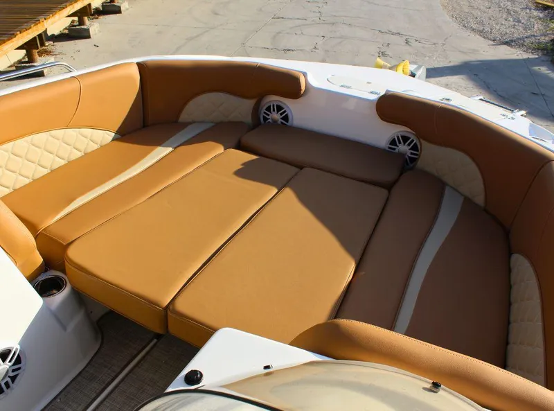 Slide: The Image of 2024 NauticStar 193 SC boat interior with tan cushioned seating. - 17