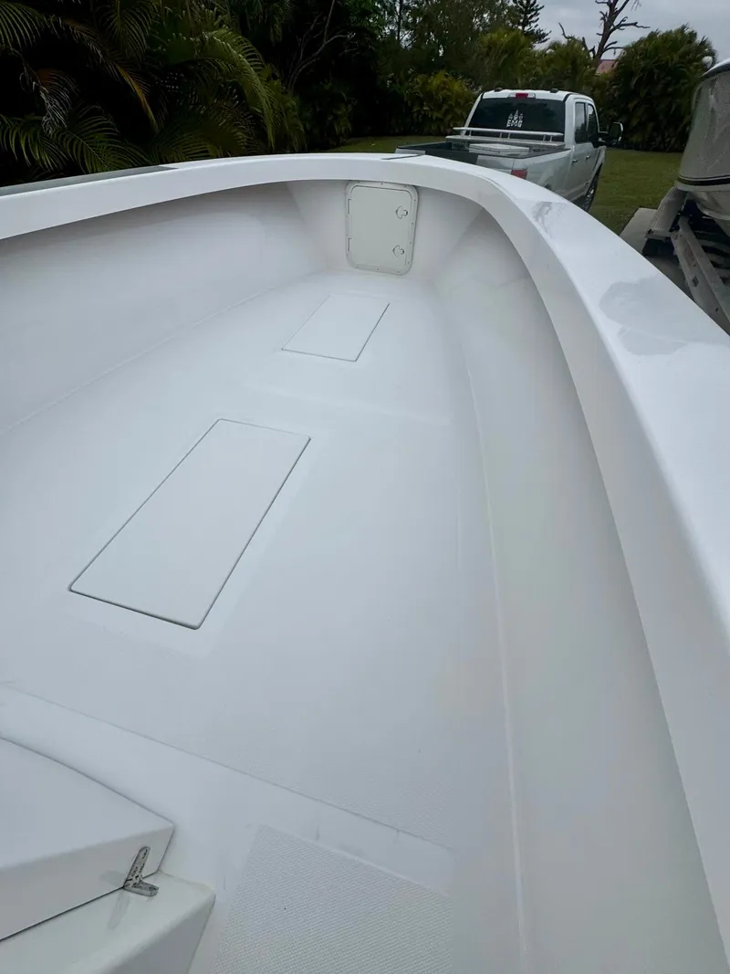 Slide: The Image of Rambo 27 boat deck, 2025 model, with sleek white finish and spacious layout. - 10