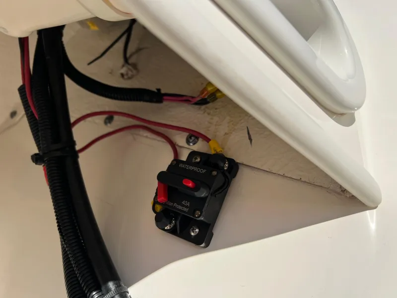 Slide: The Image of 2016 Boston Whaler 150 Super Sport electrical wiring and circuit breaker detail. - 14