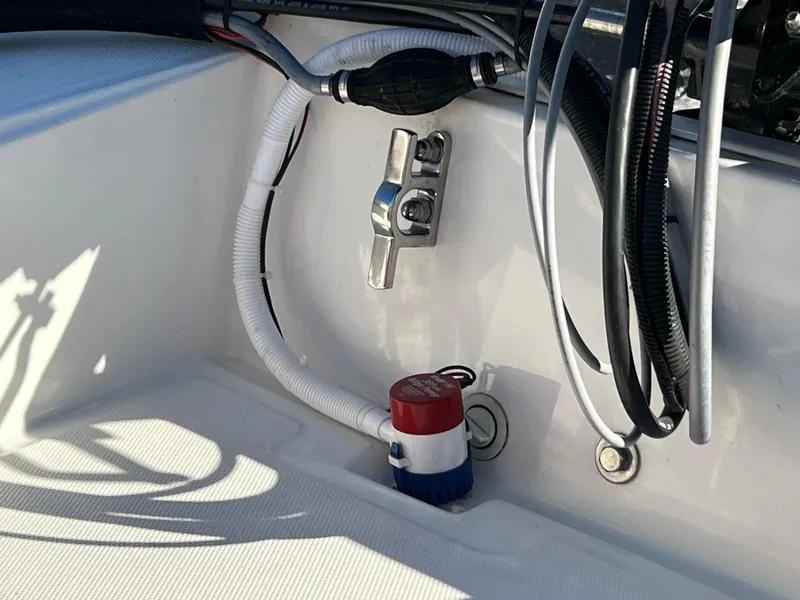 Slide: The Image of 2016 Boston Whaler 150 Super Sport interior wiring and components detail. - 16