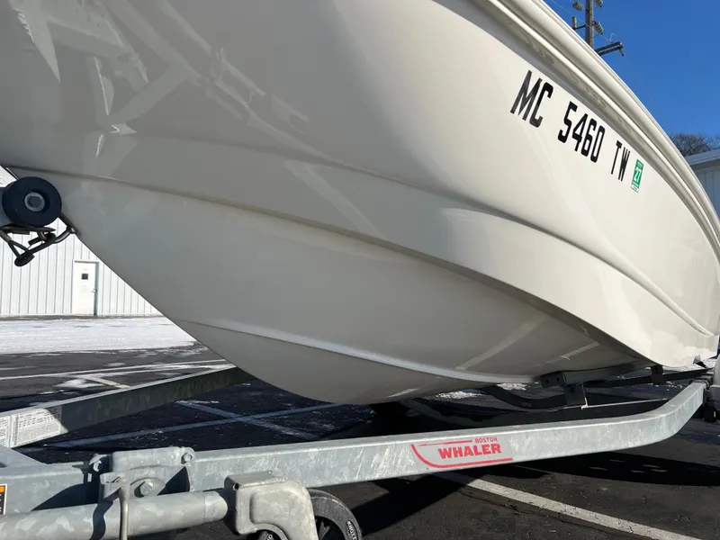 Slide: The Image of 2016 Boston Whaler 150 Super Sport boat on trailer, side view. - 3
