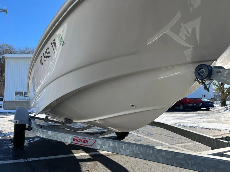 Slide: The Image of 2016 Boston Whaler 150 Super Sport on trailer, parked outdoors. - 4