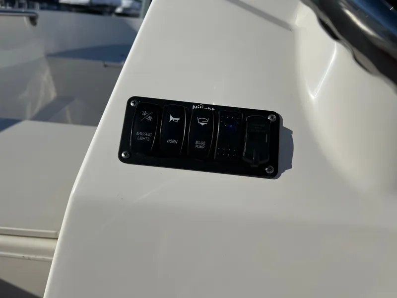 Slide: The Image of Control panel on a 2016 Boston Whaler 150 Super Sport boat. - 8