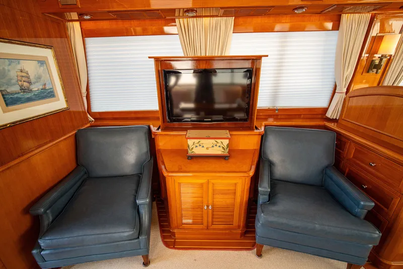 Slide: The Image of Luxurious 2004 Grand Banks 58 Eastbay FB yacht interior with TV and blue armchairs. - 21