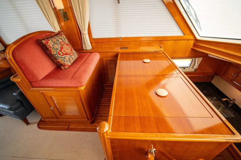 Slide: The Image of Luxurious wooden interior of 2004 Grand Banks 58 Eastbay FB yacht with elegant seating. - 23