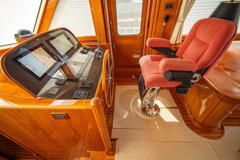 Slide: The Image of Luxurious helm of 2004 Grand Banks 58 Eastbay FB with plush captain's chair. - 27