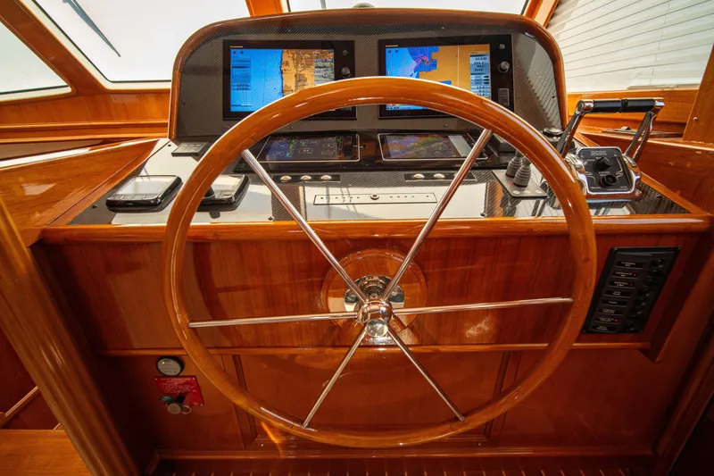 Slide: The Image of Steering wheel and navigation controls of 2004 Grand Banks 58 Eastbay FB yacht. - 30