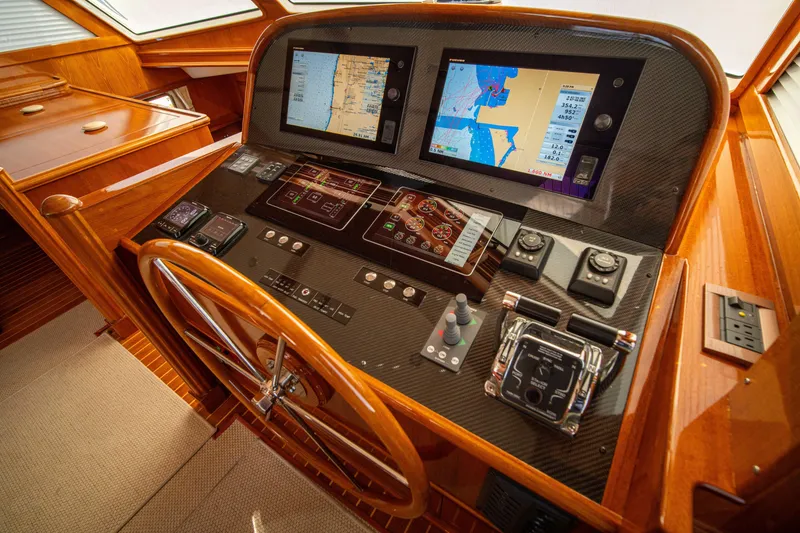 Slide: The Image of Cockpit of 2004 Grand Banks 58 Eastbay FB with navigation screens and controls. - 31
