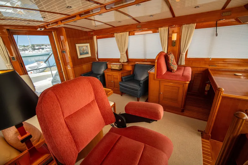 Slide: The Image of Luxurious interior of 2004 Grand Banks 58 Eastbay FB yacht with plush seating and wood paneling. - 33