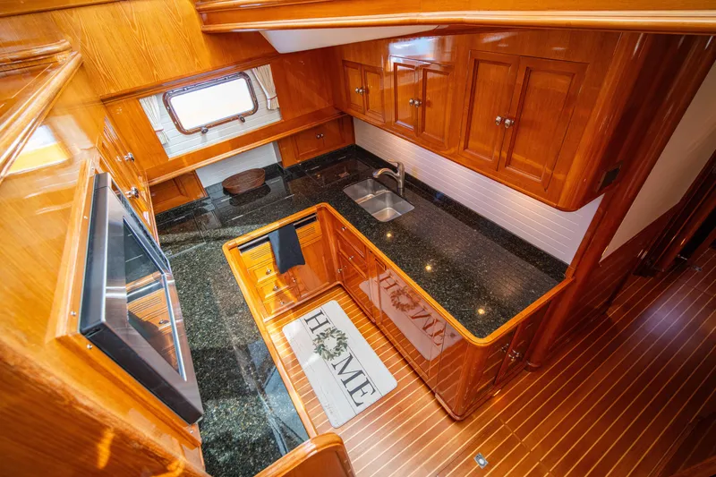 Slide: The Image of Luxurious wooden kitchen interior of 2004 Grand Banks 58 Eastbay FB yacht. - 35