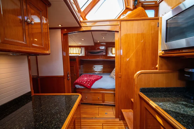 Slide: The Image of Luxurious 2004 Grand Banks 58 Eastbay FB yacht interior with wood finish and cozy cabin. - 39