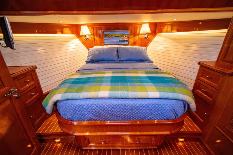 Slide: The Image of Luxurious cabin interior of 2004 Grand Banks 58 Eastbay FB yacht with cozy bedding. - 4