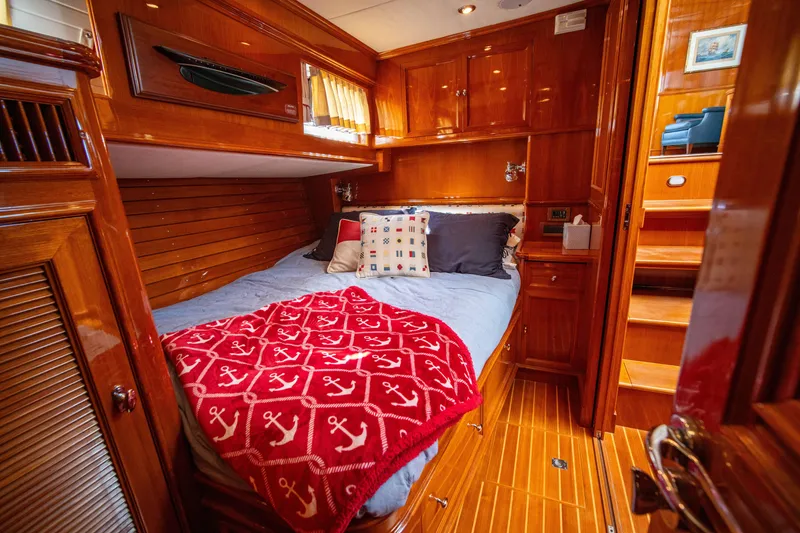 Slide: The Image of Luxurious cabin interior of 2004 Grand Banks 58 Eastbay FB yacht with wooden finishes. - 43
