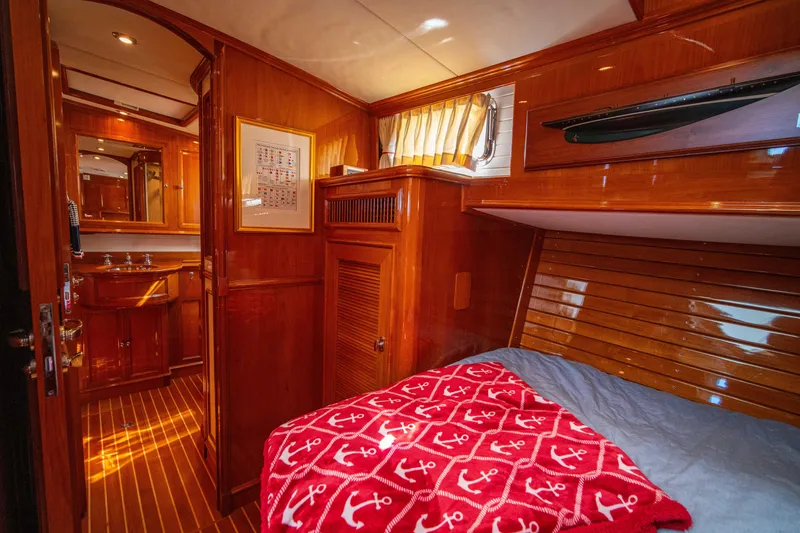 Slide: The Image of Luxurious cabin interior of 2004 Grand Banks 58 Eastbay FB yacht with wood finish. - 44