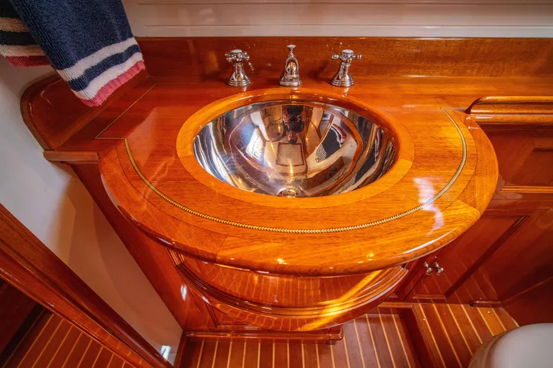 Slide: The Image of Luxurious wooden sink area on 2004 Grand Banks 58 Eastbay FB yacht. - 48