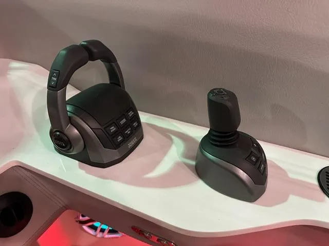 Slide: The Image of Control panel of 2025 Regal LS36 boat with joystick and throttle. - 10