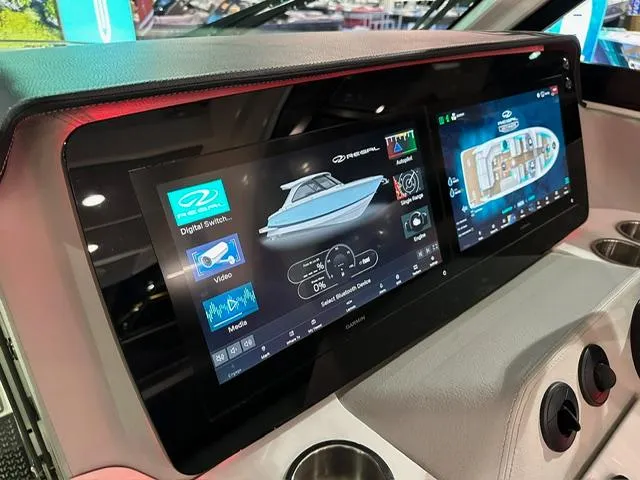Slide: The Image of 2025 Regal LS36 boat dashboard with advanced digital displays and controls. - 13