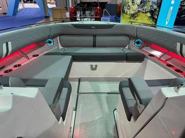 Slide: The Image of 2025 Regal LS36 boat interior with gray seating and ambient lighting. - 15