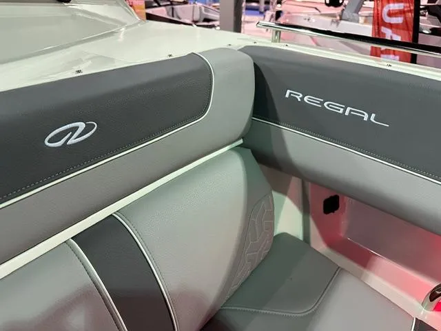 Slide: The Image of 2025 Regal LS36 boat interior with branded seating and sleek design. - 17