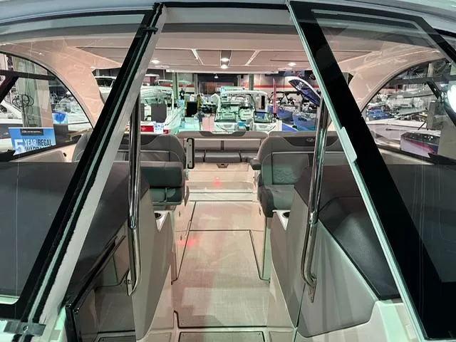 Slide: The Image of Interior view of 2025 Regal LS36 boat, showcasing seating and design features. - 18