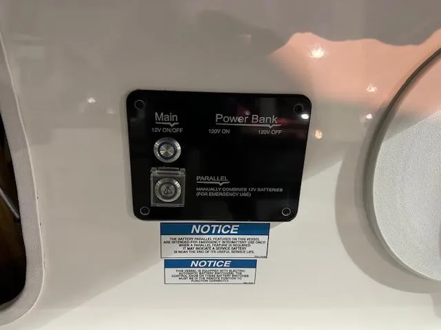 Slide: The Image of Control panel on a 2025 Regal LS36 boat, featuring main and power bank switches. - 24