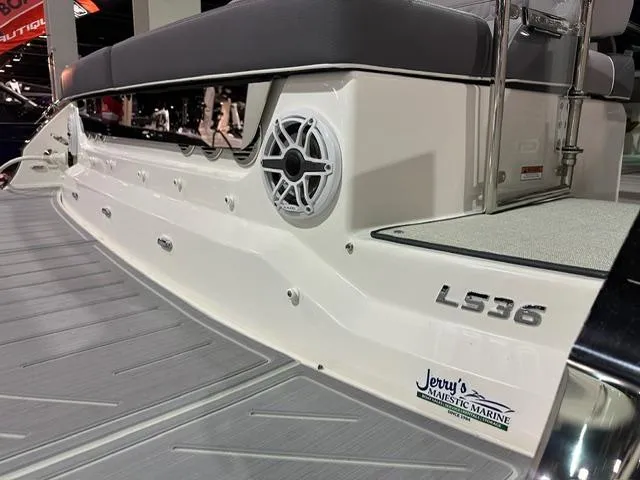 Slide: The Image of 2025 Regal LS36 boat rear view with speaker and branding. - 25
