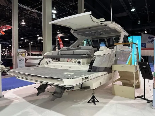 Slide: The Image of 2025 Regal LS36 luxury boat displayed indoors, showcasing sleek design and spacious seating. - 3