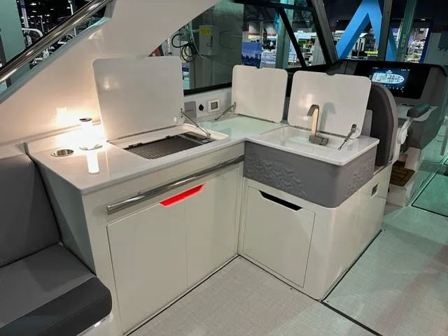 Slide: The Image of 2025 Regal LS36 yacht interior with modern kitchenette and sleek design. - 6