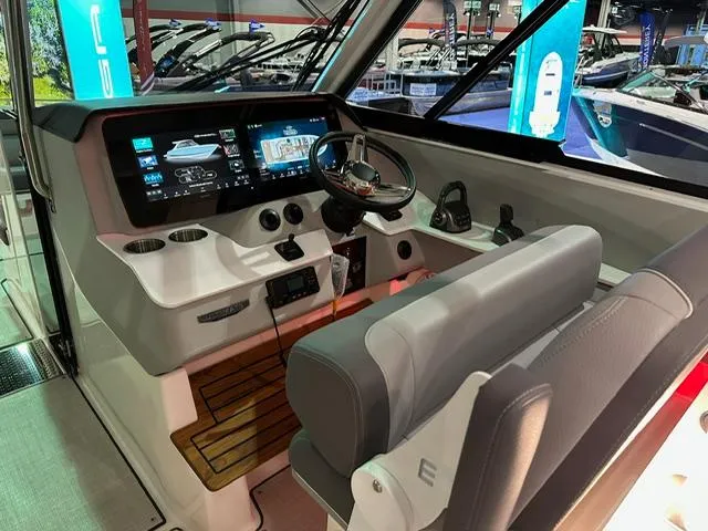 Slide: The Image of 2025 Regal LS36 boat cockpit with modern dashboard and steering wheel. - 8