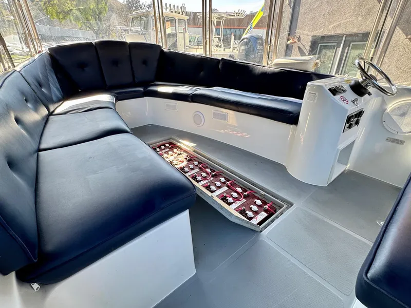 Slide: The Image of 2022 Duffy Sun Cruiser interior with black seating and modern controls. - 23