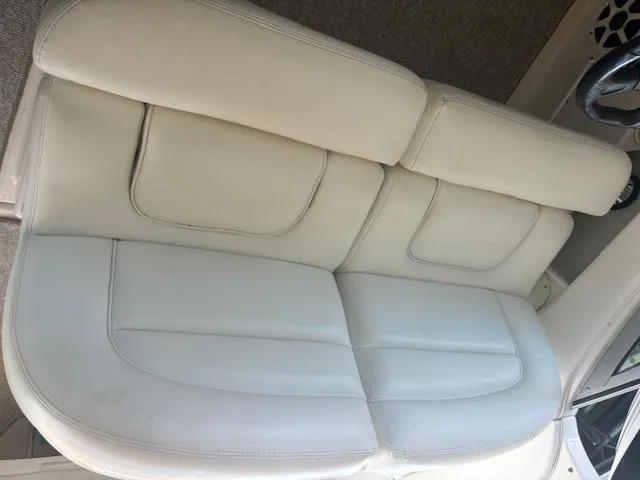 Slide: The Image of White leather seating on a 2005 Sea Ray 300 Sundancer boat. - 11