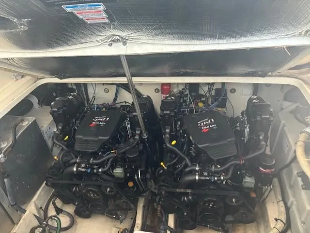 Slide: The Image of Engine compartment of a 2005 Sea Ray 300 Sundancer with twin MerCruiser engines. - 15