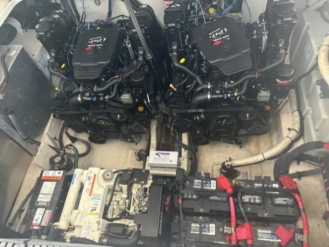Slide: The Image of Engine compartment of a 2005 Sea Ray 300 Sundancer with dual engines and batteries. - 16