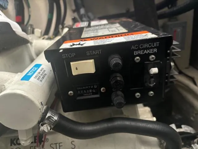 Slide: The Image of Control panel of a 2005 Sea Ray 300 Sundancer boat, featuring stop/start and AC circuit breaker. - 17