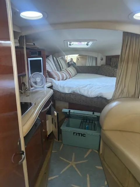 Slide: The Image of Interior of 2005 Sea Ray 300 Sundancer with cozy bed and kitchenette. - 20