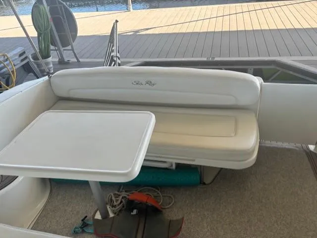Slide: The Image of 2005 Sea Ray 300 Sundancer boat interior with seating and table. - 7