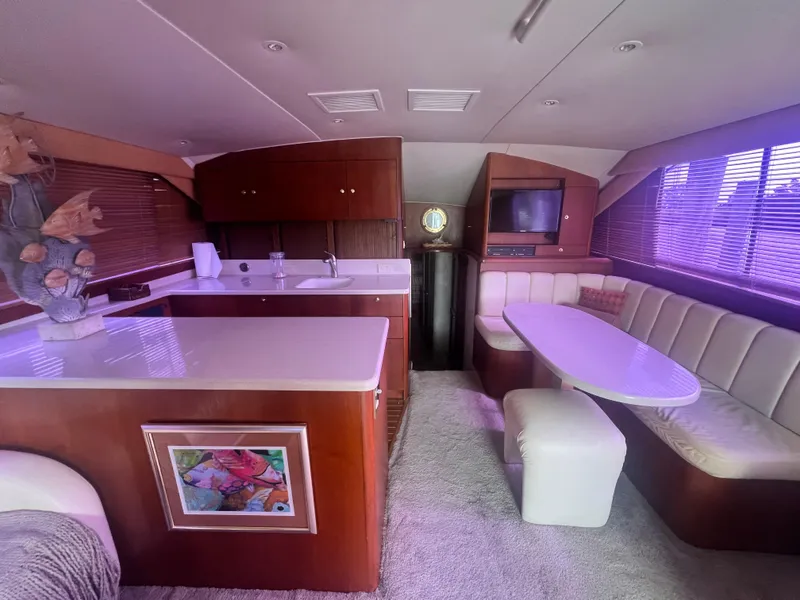 Slide: The Image of Interior of 1996 Ocean Yachts 48 Super Sport with kitchen and dining area. - 14