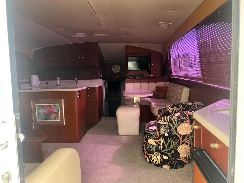 Slide: The Image of Interior of 1996 Ocean Yachts 48 Super Sport with cozy seating and modern amenities. - 15