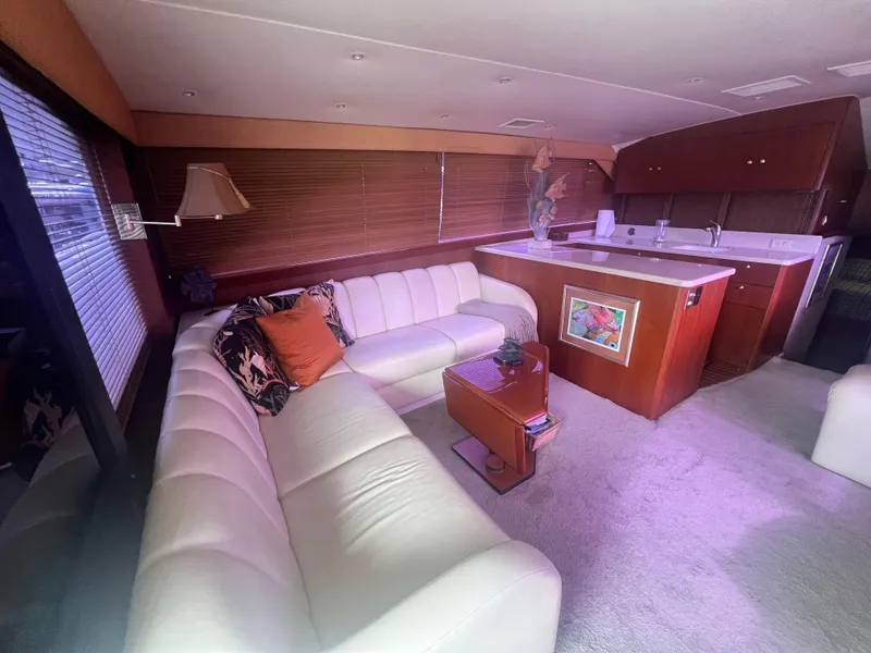 Slide: The Image of Luxurious interior of a 1996 Ocean Yachts 48 Super Sport with plush seating and elegant decor. - 16