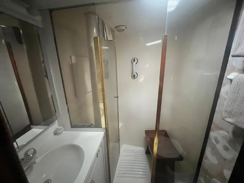 Slide: The Image of Bathroom interior of 1996 Ocean Yachts 48 Super Sport with shower and sink. - 25