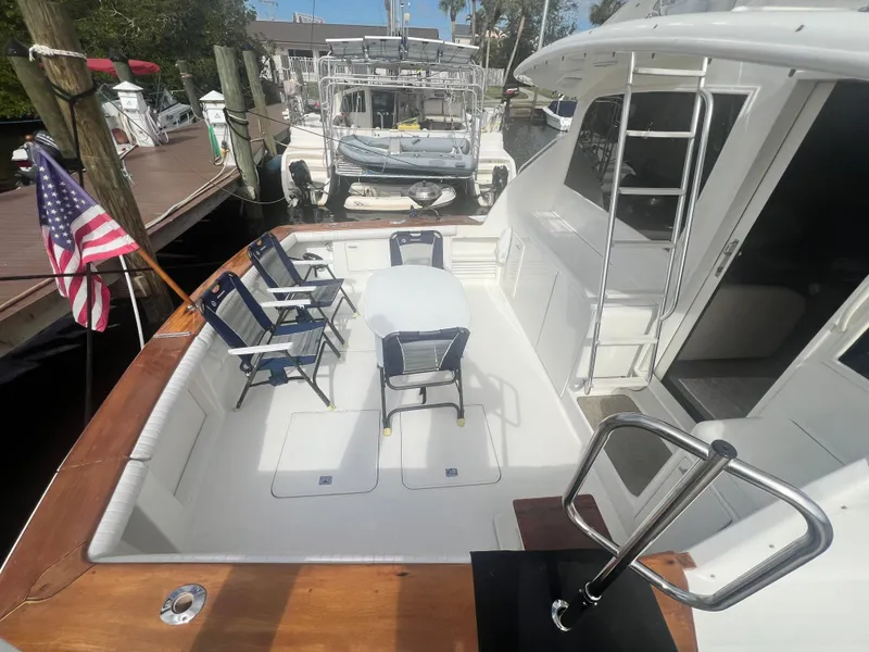 Slide: The Image of 1996 Ocean Yachts 48 Super Sport deck with seating and American flag. - 6