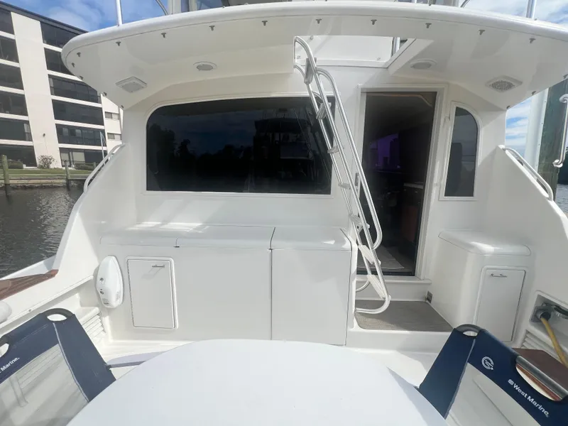 Slide: The Image of 1996 Ocean Yachts 48 Super Sport yacht deck with seating and storage. - 7
